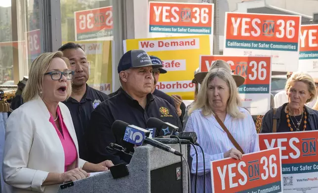 Los Angeles City Council member Traci Park, at podium left, is joined by United Firefighters of Los Angeles City President Local 112, President Freddy Escobar, third from left, with a coalition of Los Angeles area elected leaders, public safety officials and business leaders to announce their support for Proposition 36 on the November ballot at a news conference in the Venice neighborhood in Los Angeles, on Monday, Sept. 30, 2024. (AP Photo/Damian Dovarganes)