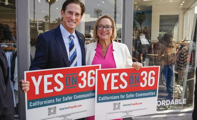 Nathan Hochman, a candidate for attorney general of California, left, and Los Angeles City Council member Traci Park, gather a coalition of Los Angeles area elected leaders, public safety officials and business leaders to announce their support for Proposition 36 on the November ballot at a news conference in the Venice district of Los Angeles, Monday, Sept. 30, 2024. (AP Photo/Damian Dovarganes)