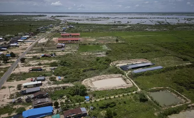 An aerial view of Em Phat's eel farm on the edges of Tonle Sap lake, north of Phnom Penh, Cambodia, Wednesday, July 31, 2024. (AP Photo/Anton L. Delgado)