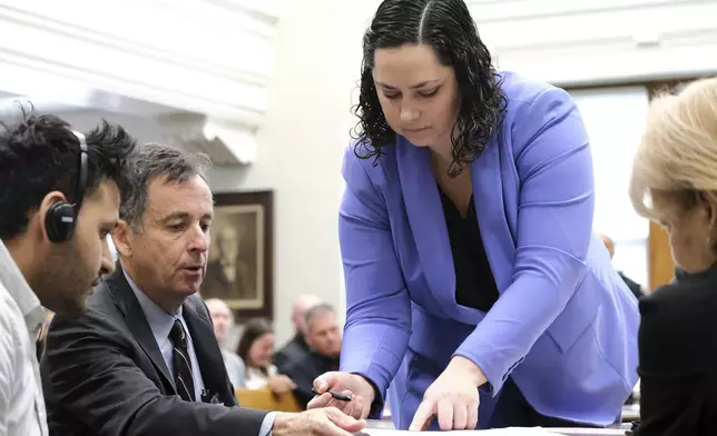 FILE - Defense attorneys Kaitlyn Beck and John Donnelly present the not guilty plea for Jose Ibarra to sign during Ibarra's court appearance, Friday, May 31, 2024, in Athens, Ga. (Nell Carroll/Atlanta Journal-Constitution via AP, File, Pool)