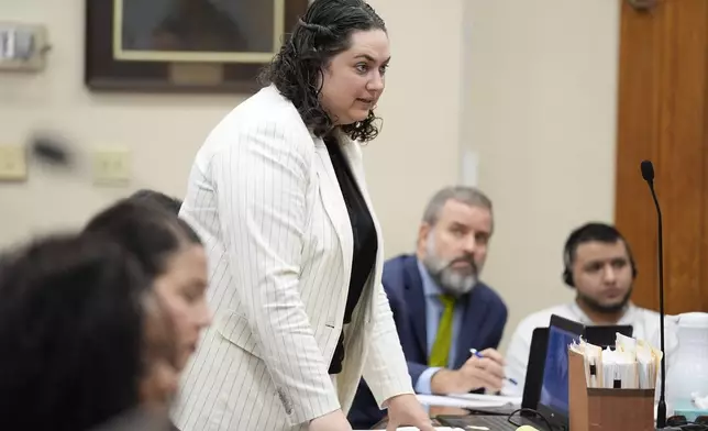 Defense attorneys Kaitlyn Beck speaks to witness Sgt. Joshua Epps of the University of Georgia Police Department during his testimony as Jose Ibarra, accused of killing a nursing student, Laken Hope Riley, appears in court for a motion hearing on Friday, Oct. 11, 2024, in Athens, Ga. (AP Photo/Brynn Anderson, Pool)