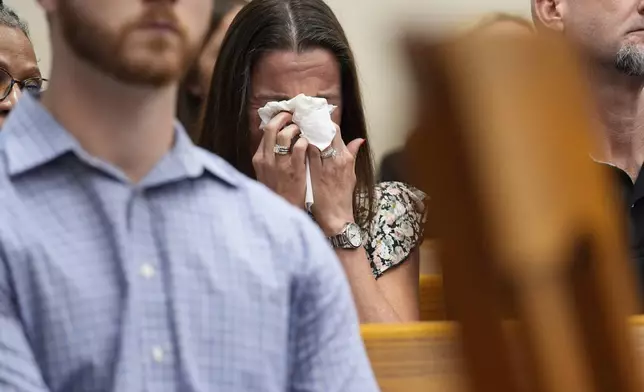 Allyson Phillips, mother of Laken Hope Riley, cries during a video as Jose Ibarra appears in court for a motion hearing, Friday, Oct. 11, 2024, in Athens, Ga. Ibarra is accused of killing a nursing student, Riley, whose body was found on the University of Georgia campus and appears in court for a motions hearing ahead of his scheduled trial next month. (AP Photo/Brynn Anderson, Pool)