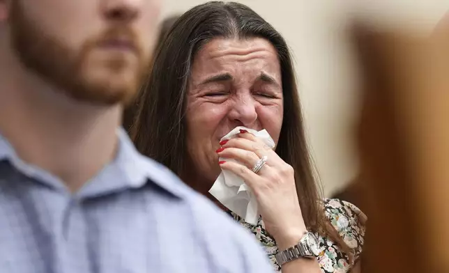 Allyson Phillips, mother of Laken Hope Riley, cries during a video as Jose Ibarra appears in court for a motion hearing, Friday, Oct. 11, 2024, in Athens, Ga. Ibarra is accused of killing a nursing student, Riley, whose body was found on the University of Georgia campus and appears in court for a motions hearing ahead of his scheduled trial next month. (AP Photo/Brynn Anderson, Pool)