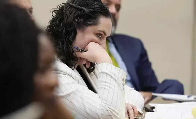 Defense attorney Kaitlyn Beck representing Jose Ibarra who is accused of killing a nursing student Laken Hope Riley, listens to a witness's testimony during a motion hearing, Friday, Oct. 11, 2024, in Athens, Ga. (AP Photo/Brynn Anderson, Pool)