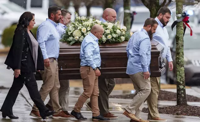 FILE - The casket of Laken Hope Riley is carried Friday, March 1, 2024, in Woodstock, Ga. (AP Photo/Jason Allen, File)