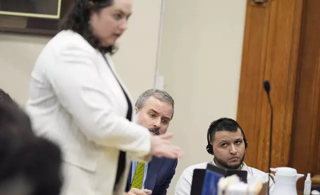 Defense attorneys Kaitlyn Beck speaks to a witness as Jose Ibarra, accused of killing a nursing student, Laken Hope Riley, right, appears in court for a motion hearing on Friday, Oct. 11, 2024, in Athens, Ga. (AP Photo/Brynn Anderson, Pool)