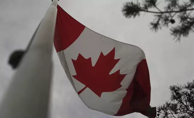 The Canadian flag is blown by wind on Centre Island in Toronto on Thursday, Sept. 19, 2024. (AP Photo/Angie Wang)