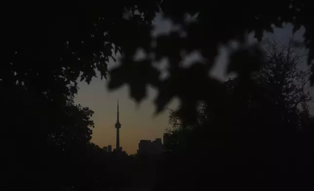 The CN Tower is seen from Trinity Bellwoods Park in Toronto on Wednesday, Sept. 18, 2024. (AP Photo/Angie Wang)