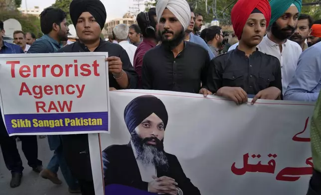 FILE -Members of Sikh community hold a protest against the killing of Hardeep Singh Nijjar, in Lahore, Pakistan, Sept. 20, 2023. (AP Photo/K.M. Chaudary, File)