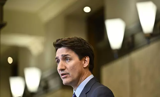 Canadian Prime Minister Justin Trudeau speaks at a news conference on the investigative efforts related to violent criminal activity occurring in Canada with connections to India, on Parliament Hill in Ottawa, Ontario, on Monday, Oct. 14, 2024. (Justin Tang/The Canadian Press via AP)