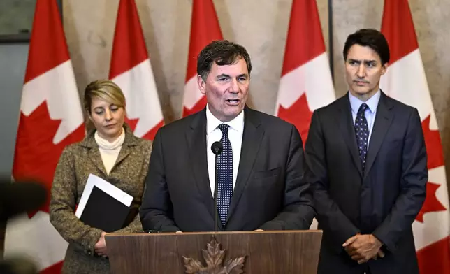 Minister of Public Safety, Democratic Institutions and Intergovernmental Affairs Dominic LeBlanc, centre, Prime Minister Justin Trudeau, right, and Minister of Foreign Affairs Melanie Joly participate in a news conference on the investigative efforts related to violent criminal activity occurring in Canada with connections to India, on Parliament Hill in Ottawa, on Monday, Oct. 14, 2024. (Justin Tang/The Canadian Press via AP)