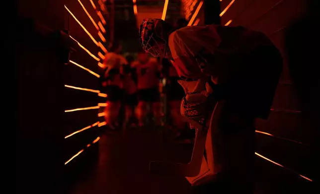 Philadelphia Flyers' Aleksei Kolosov waits to warm up before an NHL hockey game against the Montreal Canadiens, Sunday, Oct. 27, 2024, in Philadelphia. (AP Photo/Matt Slocum)