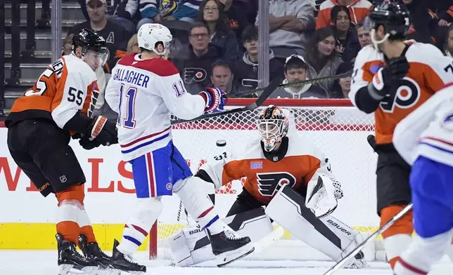 Montreal Canadiens' Brendan Gallagher (11) scores against Philadelphia Flyers' Aleksei Kolosov (35) during the second period of an NHL hockey game, Sunday, Oct. 27, 2024, in Philadelphia. (AP Photo/Matt Slocum)