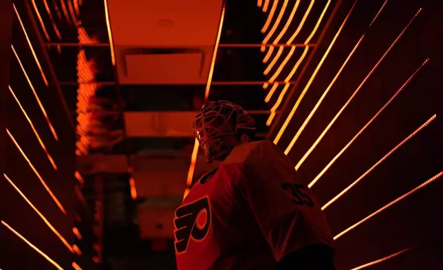 Philadelphia Flyers' Aleksei Kolosov waits to warm up before an NHL hockey game against the Montreal Canadiens, Sunday, Oct. 27, 2024, in Philadelphia. (AP Photo/Matt Slocum)