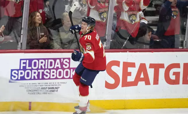 Florida Panthers center Jesper Boqvist celebrates after he scored during the first period of an NHL hockey game against the Vancouver Canucks, Thursday, Oct. 17, 2024, in Sunrise, Fla. (AP Photo/Wilfredo Lee)