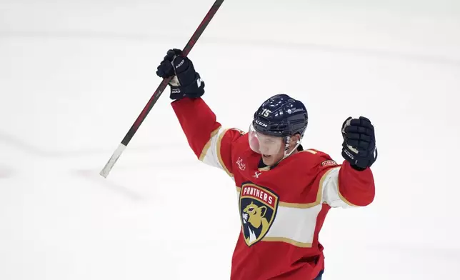 Florida Panthers center Anton Lundell celebrates a goal during the second period of an NHL hockey game against the Vancouver Canucks, Thursday, Oct. 17, 2024, in Sunrise, Fla. (AP Photo/Wilfredo Lee)