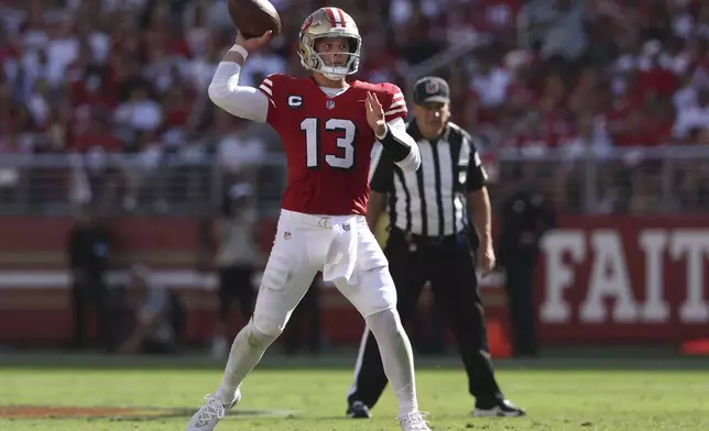 San Francisco 49ers quarterback Brock Purdy (13) passes against the Arizona Cardinals during the second half of an NFL football game in Santa Clara, Calif., Sunday, Oct. 6, 2024. (AP Photo/Jed Jacobsohn)