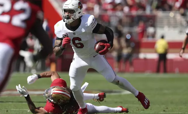 Arizona Cardinals running back James Conner (6) runs against the San Francisco 49ers during the first half of an NFL football game in Santa Clara, Calif., Sunday, Oct. 6, 2024. (AP Photo/Jed Jacobsohn)