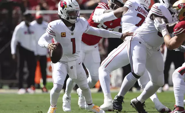 Arizona Cardinals quarterback Kyler Murray (1) scrambles out of the pocket during the first half of an NFL football game against the San Francisco 49ers in Santa Clara, Calif., Sunday, Oct. 6, 2024. (AP Photo/Jed Jacobsohn)