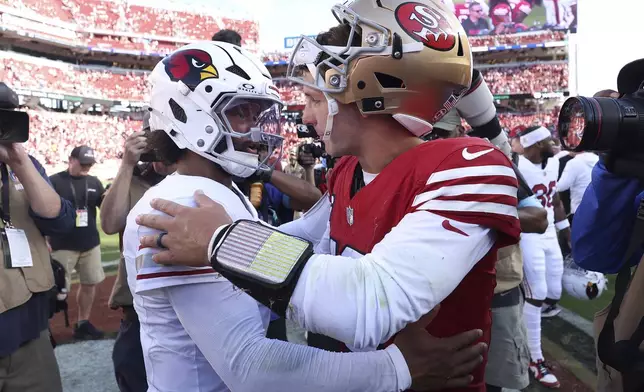 Arizona Cardinals quarterback Kyler Murray, left, greets San Francisco 49ers quarterback Brock Purdy after an NFL football game in Santa Clara, Calif., Sunday, Oct. 6, 2024. (AP Photo/Jed Jacobsohn)