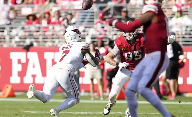 Arizona Cardinals linebacker Kyzir White (7) intercepts a pass in front of San Francisco 49ers tight end George Kittle (85) during the second half of an NFL football game in Santa Clara, Calif., Sunday, Oct. 6, 2024. (AP Photo/Godofredo A. Vásquez)