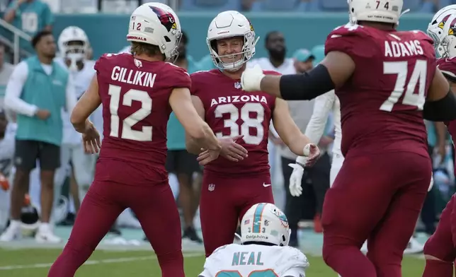 Arizona Cardinals place kicker Chad Ryland (38) celebrates after they won the game on a last minute field goal during the second half of an NFL football game against the Miami Dolphins, Sunday, Oct. 27, 2024, in Miami Gardens, Fla. (AP Photo/Lynne Sladky)