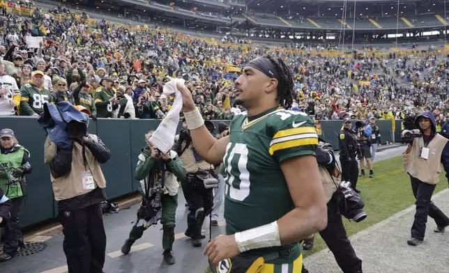 Green Bay Packers quarterback Jordan Love walks off the field after an NFL football game against the Arizona Cardinals, Sunday, Oct. 13, 2024, in Green Bay. (AP Photo/Mike Roemer)