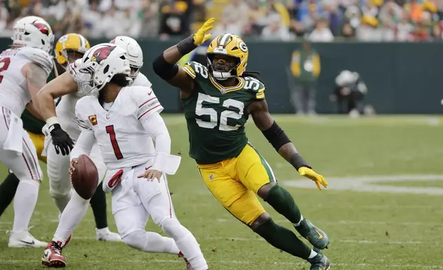 Green Bay Packers defensive end Rashan Gary (52) pressures Arizona Cardinals quarterback Kyler Murray (1) during the second half of an NFL football game, Sunday, Oct. 13, 2024, in Green Bay. (AP Photo/Mike Roemer)