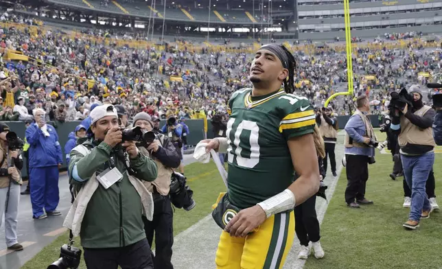 Green Bay Packers quarterback Jordan Love walks off the field after an NFL football game against the Arizona Cardinals, Sunday, Oct. 13, 2024, in Green Bay. (AP Photo/Mike Roemer)