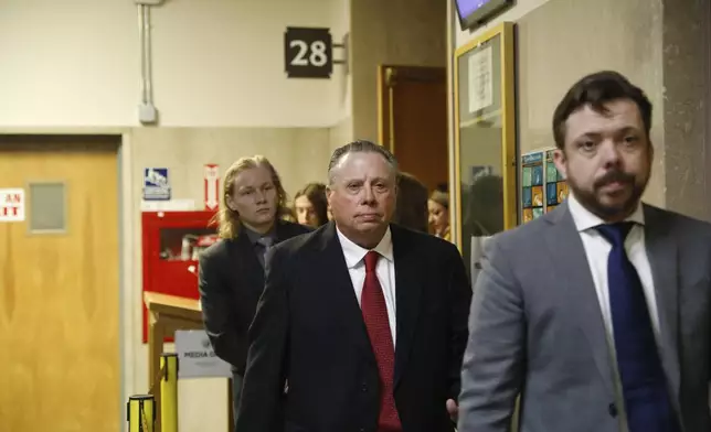 Tim Oliver Lee, right, brother of Cash App founder Bob Lee; Rick Lee, center, father of Bob Lee, Krista Lee, and other family members leave Department 28 at the Hall of Justice on the first day of the murder trial of Nima Momeni, Monday, Oct. 14, 2024, in San Francisco,. (Lea Suzuki/San Francisco Chronicle via AP)