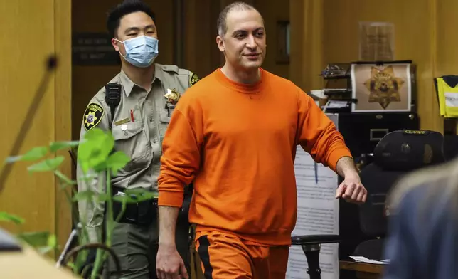 FILE - Nima Momeni, the man charged in the fatal stabbing of Cash App founder Bob Lee, makes his way into the courtroom for his arraignment in San Francisco, May 2, 2023. (Gabrielle Lurie/San Francisco Chronicle via AP, Pool, File)