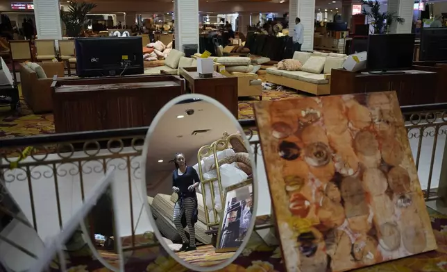 People look at items for sale at the shuttered Tropicana hotel-casino Saturday, May 25, 2024, in Las Vegas. (AP Photo/John Locher)