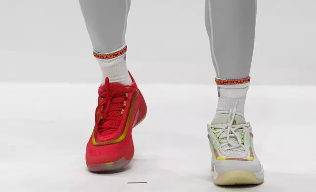 Cleveland Cavaliers guard Donovan Mitchell wears soon to be released Adidas with a gummy bear theme during an NBA basketball media day, Monday, Sept. 30, 2024, in Cleveland. (AP Photo/Sue Ogrocki)