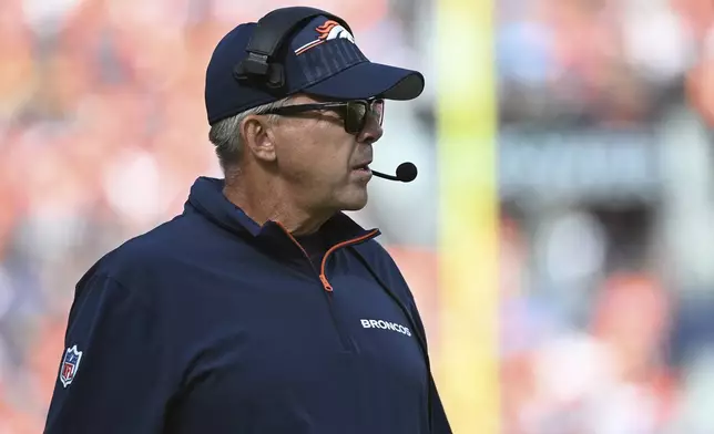 Denver Broncos head coach Sean Payton looks on during the first half of an NFL football game against the Los Angeles Chargers, Sunday, Oct. 13, 2024, in Denver. (AP Photo/Geneva Heffernan)