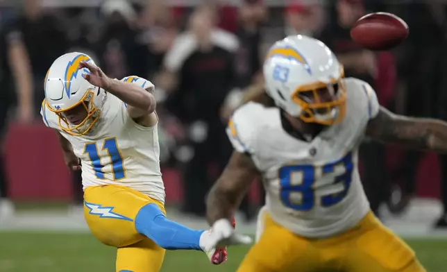 Los Angeles Chargers place kicker Cameron Dicker (11) kicks a 50-yard field goal during the first half of an NFL football game against the Arizona Cardinals, Monday, Oct. 21, 2024, in Glendale Ariz. (AP Photo/Matt York)