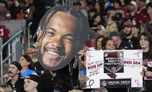 Fans cheer during the first half of an NFL football game between the Arizona Cardinals and the Los Angeles Chargers, Monday, Oct. 21, 2024, in Glendale Ariz. (AP Photo/Ross D. Franklin)