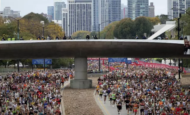 Runners head north on Columbus Avenue in Grant Park to start the Chicago Marathon on Sunday, Oct. 13, 2024. (Tess Crowley/Chicago Tribune via AP)