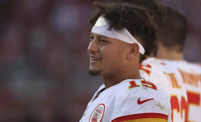 Kansas City Chiefs quarterback Patrick Mahomes watches from the sideline during the second half of an NFL football game against the San Francisco 49ers in Santa Clara, Calif., Sunday, Oct. 20, 2024. (AP Photo/Jed Jacobsohn)