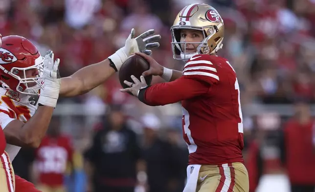 San Francisco 49ers quarterback Brock Purdy (13) passes against the Kansas City Chiefs during the second half of an NFL football game in Santa Clara, Calif., Sunday, Oct. 20, 2024. (AP Photo/Jed Jacobsohn)