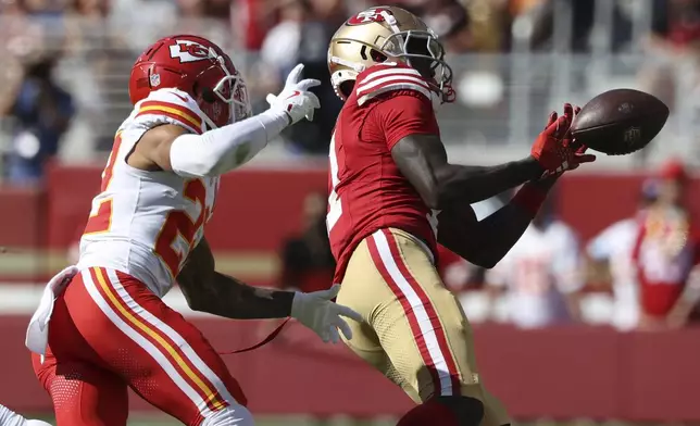 San Francisco 49ers wide receiver Brandon Aiyuk, right, cannot catch a pass next to Kansas City Chiefs cornerback Trent McDuffie during the first half of an NFL football game in Santa Clara, Calif., Sunday, Oct. 20, 2024. (AP Photo/Jed Jacobsohn)