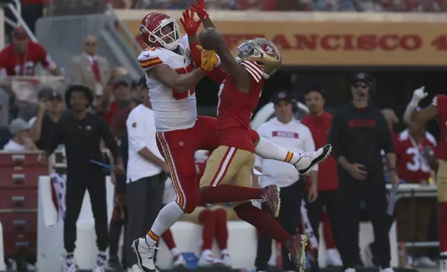 Kansas City Chiefs tight end Travis Kelce, left, cannot catch a pass while being defended by San Francisco 49ers cornerback Charvarius Ward during the second half of an NFL football game in Santa Clara, Calif., Sunday, Oct. 20, 2024. (AP Photo/Jed Jacobsohn)