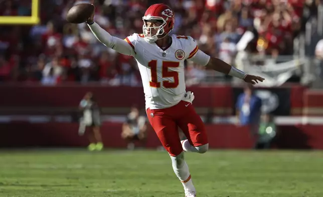 Kansas City Chiefs quarterback Patrick Mahomes (15) runs against the San Francisco 49ers during the second half of an NFL football game in Santa Clara, Calif., Sunday, Oct. 20, 2024. (AP Photo/Jed Jacobsohn)