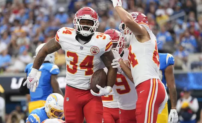 Kansas City Chiefs running back Samaje Perine celebrates after scoring during the second half of an NFL football game against the Los Angeles Chargers Sunday, Sept. 29, 2024, in Inglewood, Calif. (AP Photo/Ashley Landis)