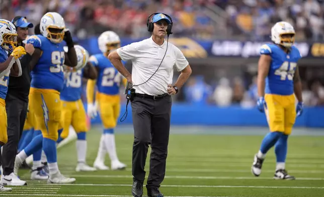 Los Angeles Chargers head coach Jim Harbaugh watches during the second half of an NFL football game against the Kansas City Chiefs Sunday, Sept. 29, 2024, in Inglewood, Calif. (AP Photo/Marcio Jose Sanchez)