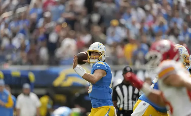 Los Angeles Chargers quarterback Justin Herbert throws during the first half of an NFL football game against the Kansas City Chiefs Sunday, Sept. 29, 2024, in Inglewood, Calif. (AP Photo/Ashley Landis)