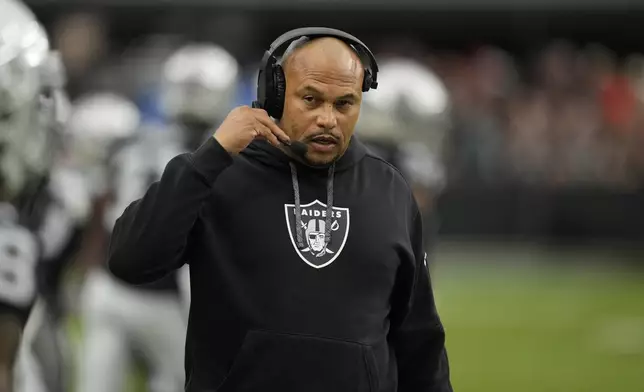 Las Vegas Raiders head coach Antonio Pierce watches from the sidelines during the first half of an NFL football game against the Kansas City Chiefs Sunday, Oct. 27, 2024, in Las Vegas. (AP Photo/John Locher)