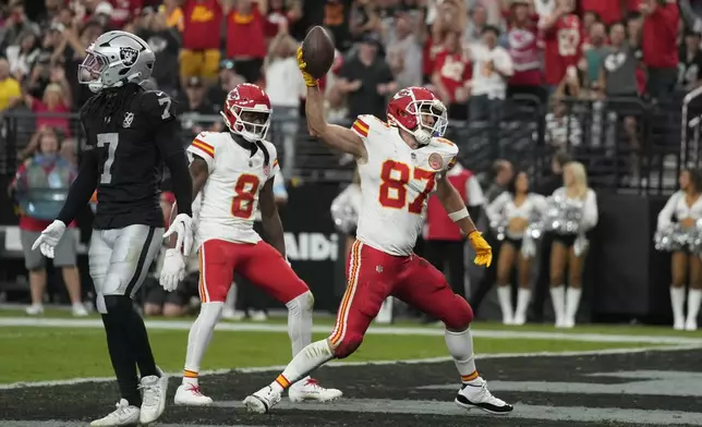 Kansas City Chiefs tight end Travis Kelce (87) celebrates after catching a touchdown pass during the first half of an NFL football game against the Las Vegas Raiders Sunday, Oct. 27, 2024, in Las Vegas. (AP Photo/John Locher)