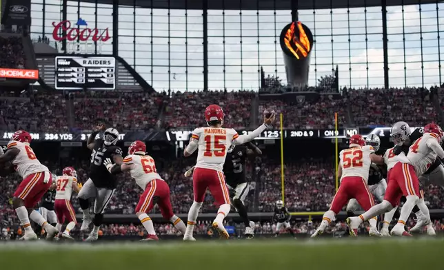 Kansas City Chiefs quarterback Patrick Mahomes (15) throws during the second half of an NFL football game against the Las Vegas Raiders Sunday, Oct. 27, 2024, in Las Vegas. (AP Photo/John Locher)