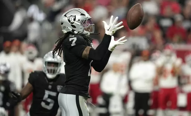 Las Vegas Raiders safety Tre'von Moehrig intercepts a pass against the Kansas City Chiefs during the second half of an NFL football game Sunday, Oct. 27, 2024, in Las Vegas. (AP Photo/John Locher)