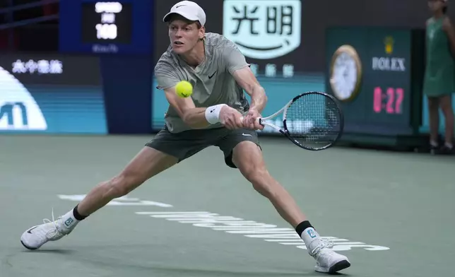 Jannik Sinner of Italy plays a backhand return against Machac of the Czech Republic during the men's singles semifinals match in the Shanghai Masters tennis tournament at Qizhong Forest Sports City Tennis Center in Shanghai, China, Saturday, Oct. 12, 2024. (AP Photo/Andy Wong)